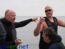 Shel Streit, Roger Carlson, and Mike Kass discussing the best spot to find bugs.