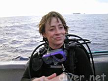 Mary Lynn Price (DiveFilm.com) with Clipperton Island in the distance