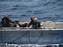 Pedro Medina Rosas & Kirstie Kaiser waving, & Robert Goren return from Roca Partida. Elaine Jobin & Alicia Hermosillo are facing away.