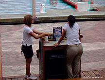 Waitress Yolanda Malvaez and the hostess wait for customers on a very slow afternoon at No Worrys