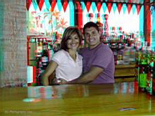 Waitress Yolanda Malvaez and the bartender pose for a photo